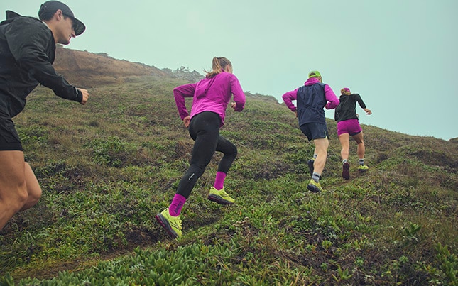Group of people running on a trail